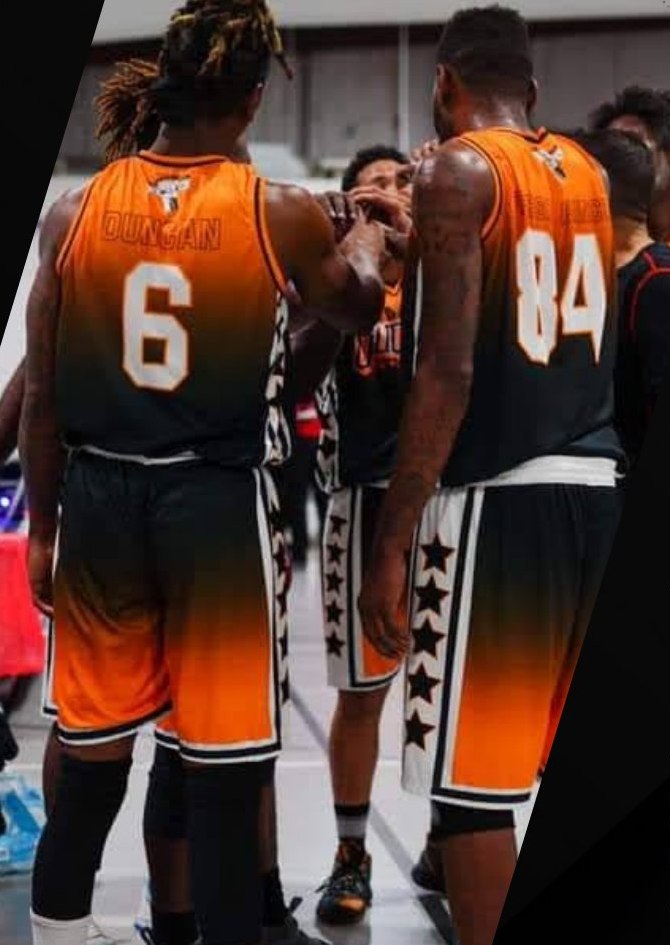 Tucson Buckets players in orange and black uniforms